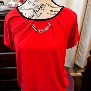 Red jeweled blouse